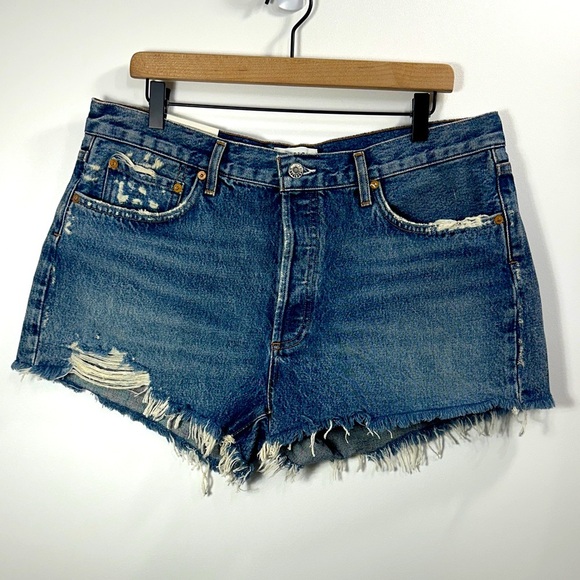 AGOLDE Parker cut off button fly denim distressed shorts size 32. NWT.